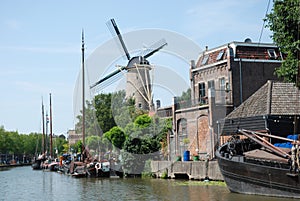 Dutch cityscape Gouda with canal-windmill-ships