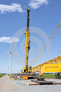 Dutch construction site new wind turbine farm with big crane