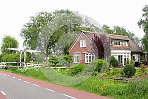 Dutch country house with a garden, canal and a draw-bridge, Netherlands