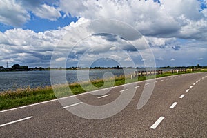 Dutch country road under the cloudy sky