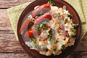 Dutch cuisine: stamppot from potatoes, sauerkraut and carrot close-up. horizontal top view