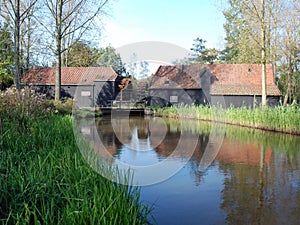 Dutch double water mill mirror in river-Eindhoven