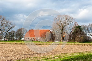 Dutch farm in a colorful autumnal landscape