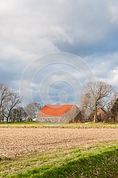 Dutch farm in a colorful autumnal landscape