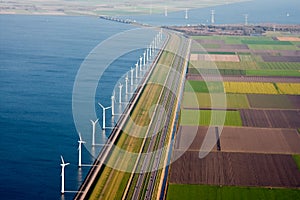 Dutch farmland with windmills along the