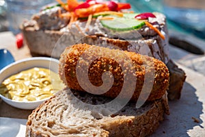 Dutch fast food, deep fried croquettes filled with ground beef meat served on bread