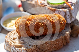 Dutch fast food, deep fried croquettes filled with ground beef meat served on bread