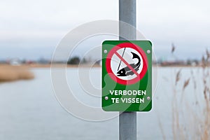 Dutch fishing prohibited sign near lake - NO FISHING