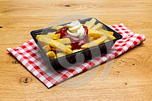 Dutch fries with ketchup and mayonnaise