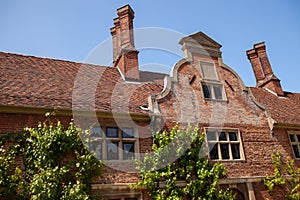 Dutch gable roof. Architectural detail on period red brick build