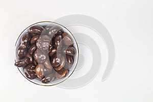 Dutch holiday gingerbread cookies covered with chocolate in a ceramic bowl