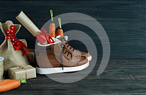 Dutch Holiday Sinterklaas background. Children`s shoes, carrots