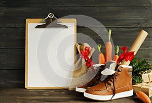 Dutch Holiday Sinterklaas background. Children`s shoes, carrots