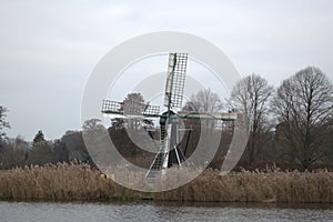 Dutch mill across a river