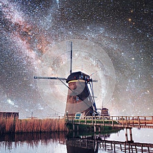 Dutch mill at night. Starry sky. Courtesy of NASA. Holland