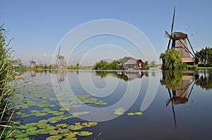 Dutch mill reflecting in a canal