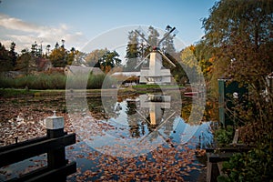 Dutch paltrok windmill with reflection in the water