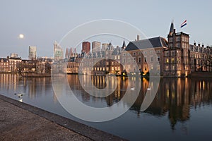 Dutch parliament or the Binnenhof at sunset with moon