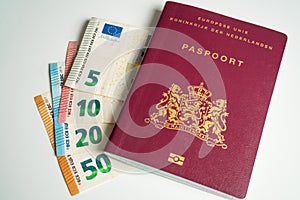 Dutch passport with Euros next to it