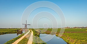 Dutch polder mill on a sunny day in spring