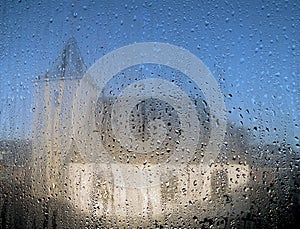 Dutch reformed chapel through a window with raindrops