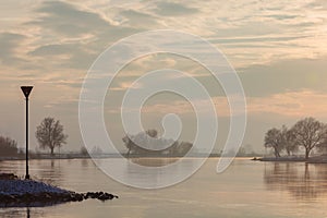 The Dutch river IJssel during sunset in winter