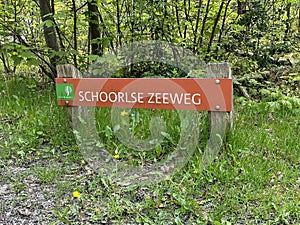 Dutch road name sign Schoorlse Zeeweg.