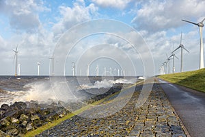 Dutch sea with off shore wind turbines and breaking waves