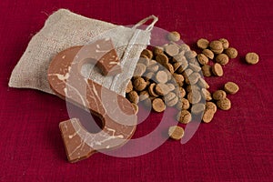 Dutch Sinterklaas tradition: A chocolate letter and a bag with candy called Pepernoten