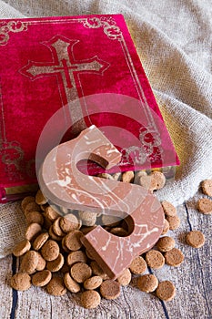 Dutch Sinterklaas tradition: A chocolate letter a book, a bag and candy called Pepernoten
