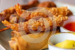 Dutch snacks for beer or wine, tempura shrimps, skewered chicken, bitterballs and hot dip sauces