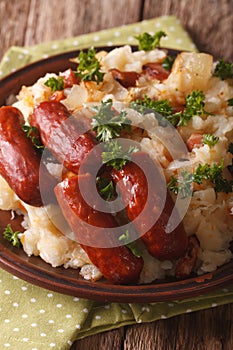 Dutch stamppot of potatoes, cabbage and carrots, with sausages c