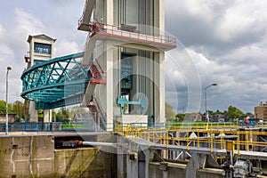 Dutch storm surge barrier with sluicegate and elevation retaining wall