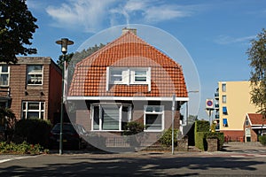 dutch street village architecture house bush places europe brick neighbourhood facade white windows doors brown roof estate