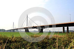 Dutch suspension bridge over the Waal river photo