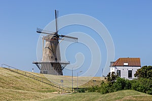 Dutch traditional windmill at dike near Vlissingen