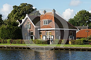 Dutch typical houses by the river bank