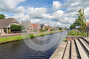 Dutch village Appelscha in Friesland with houses along a canal