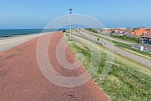 Dutch village Westkapelle protected by solid dike against North sea photo