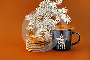 Dutch waffle stroopwafel background cookies round brown pastries blue cup coffee tea hope star christmas tree white yellow