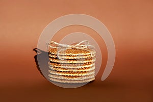 Dutch waffle stroopwafel background cookies round brown pastries blue shadow