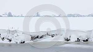 Dutch white winter landscape with snowy meadows