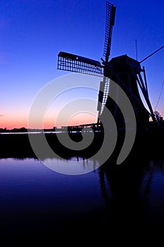 Dutch wind mill at a beautiful sunset