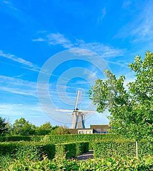 Dutch windmill against a blue sky