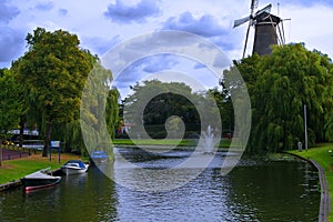 Dutch Windmill and canal in Leiden, Netherlands photo