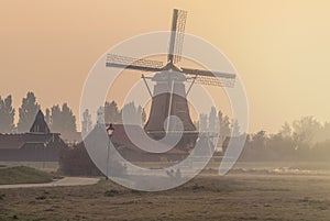 Dutch windmill on a foggy afternoon