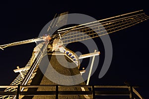 Dutch windmill illuminated in the dark