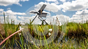 Dutch windmill in the landscape of the Dutch polder with marsh p