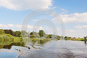 Dutch windmill near river