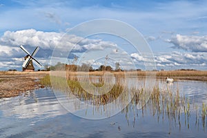 Dutch windmill over blue sky